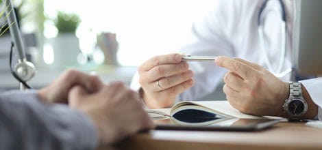 Doctor listening to patient making complaint